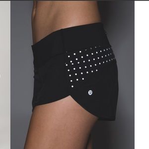 Black Lululemon Speed Shorts with reflective dots
